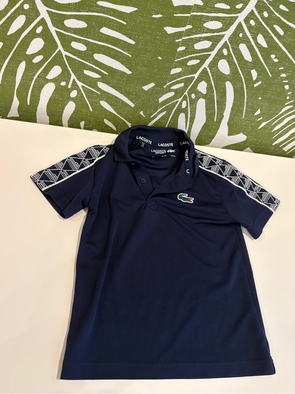 Lacoste Kids Navy Polo with Patterned Shoulder Stripes